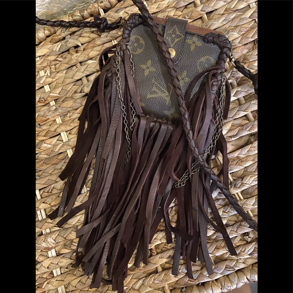 Sold Louis Vuitton fringed crossbody